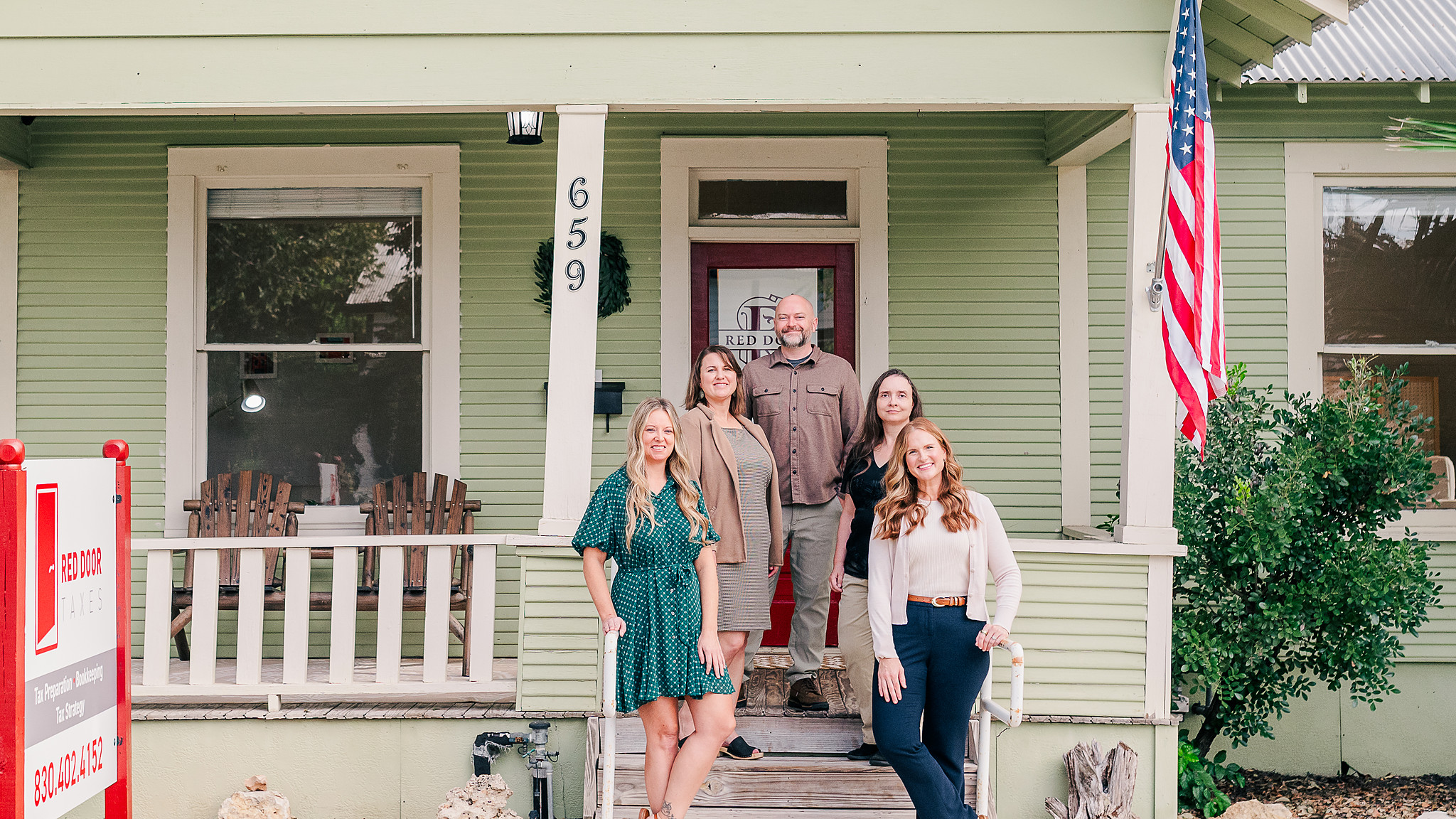 The Red Door Taxes team at the front of the office at 659 S. Castell Ave